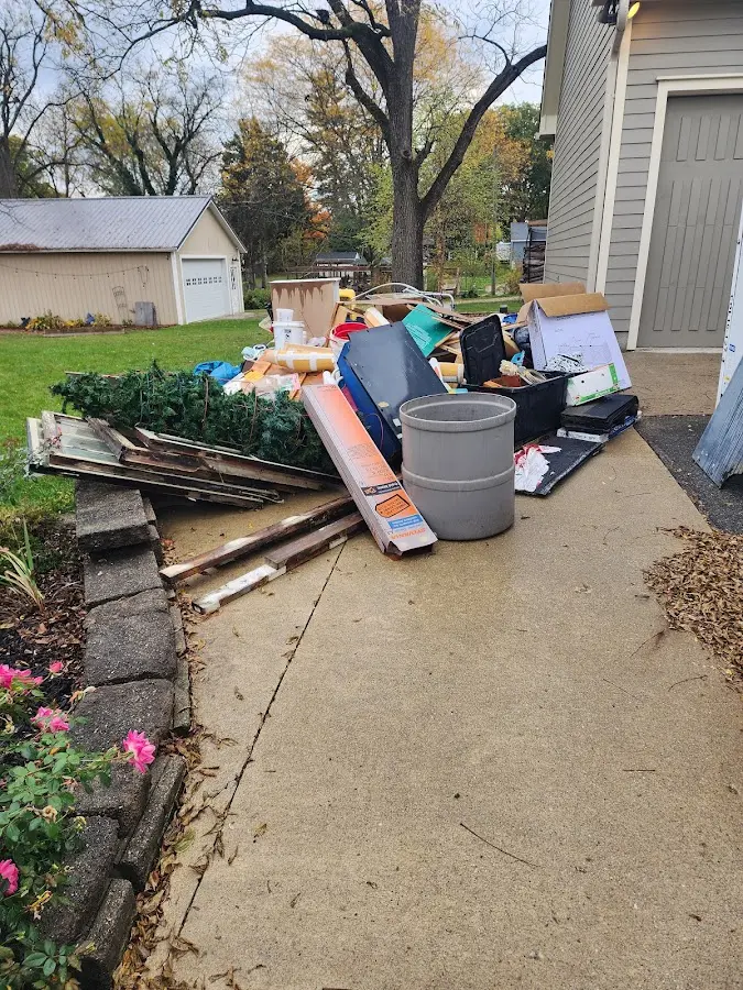 Dumpster being loaded with debris for Estate Cleanout Dumpster Rental in East Rancho Dominguez